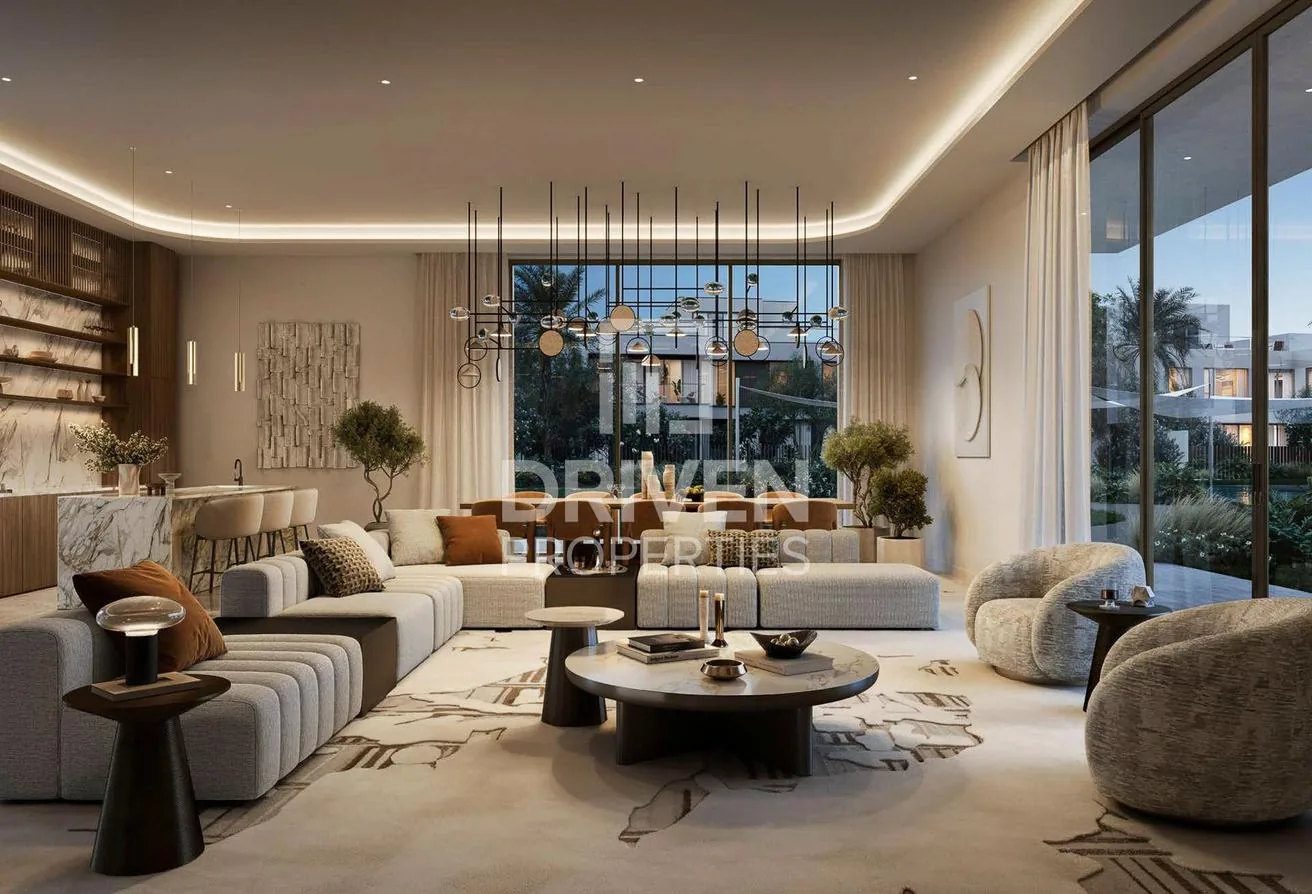 Family lounge with a marble open kitchen and warm evening light