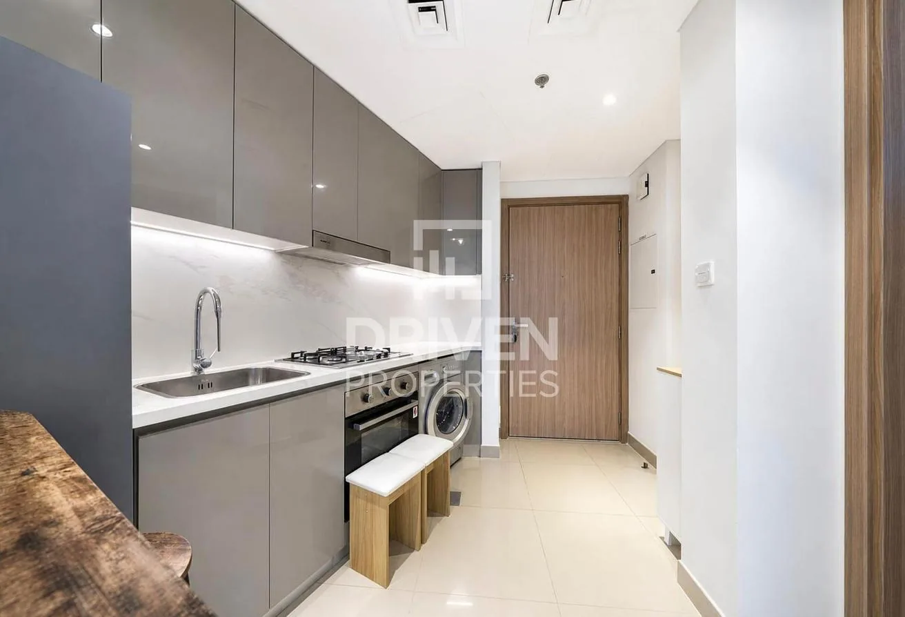 Fitted galley kitchen with gas hob, oven and washing machine