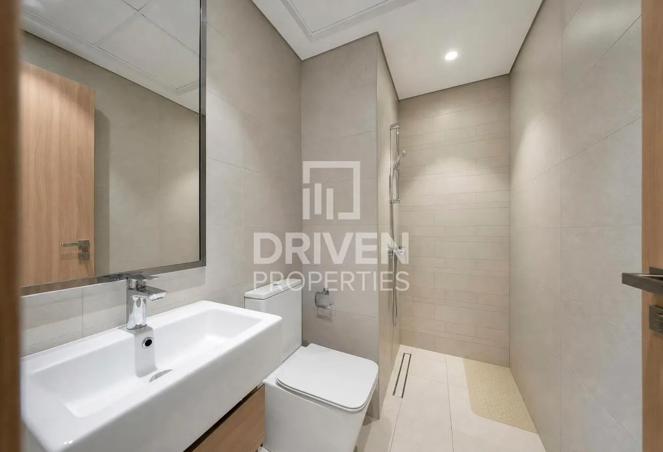 Bathroom with a floating vanity, large mirror and walk-in shower
