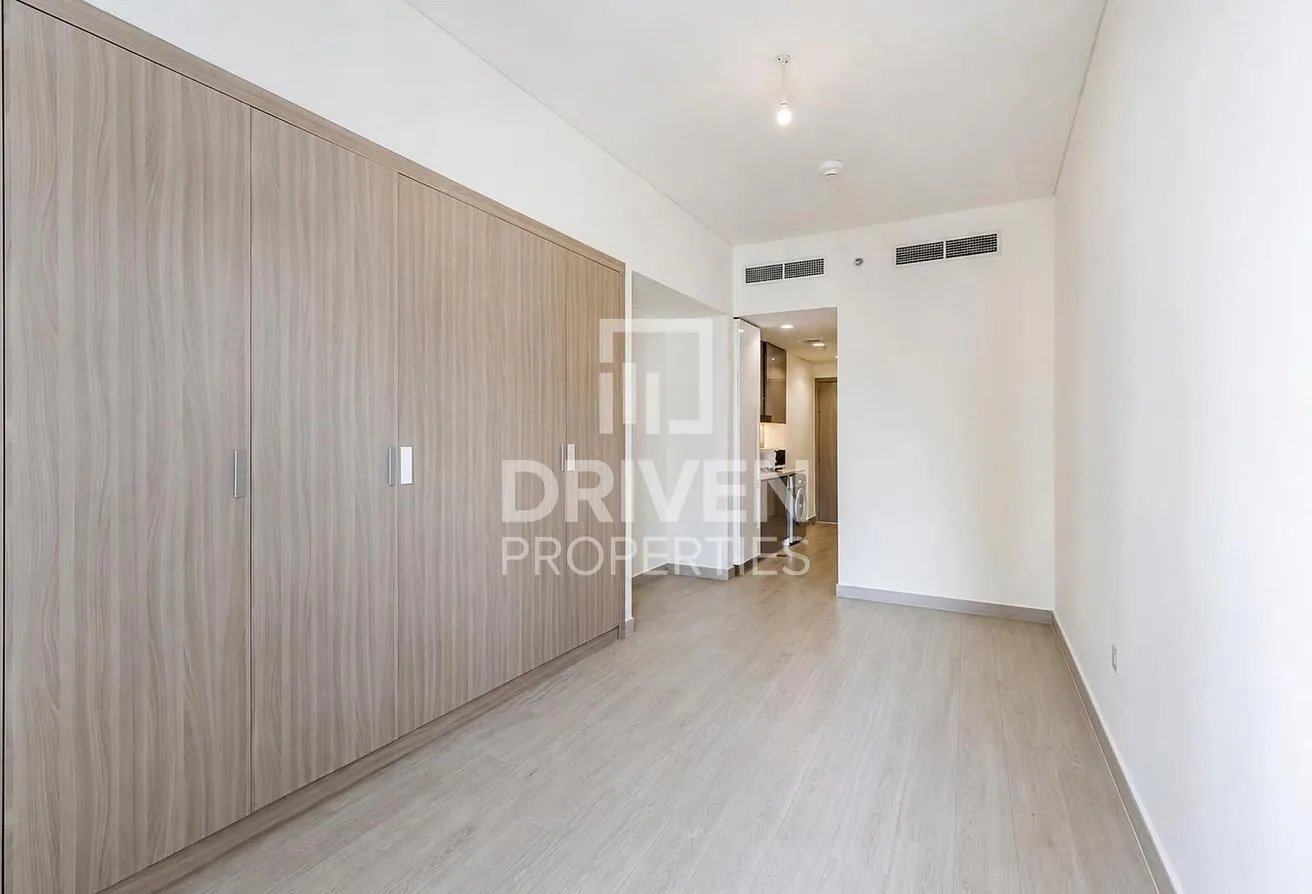 Full wall of built-in wardrobes in the studio