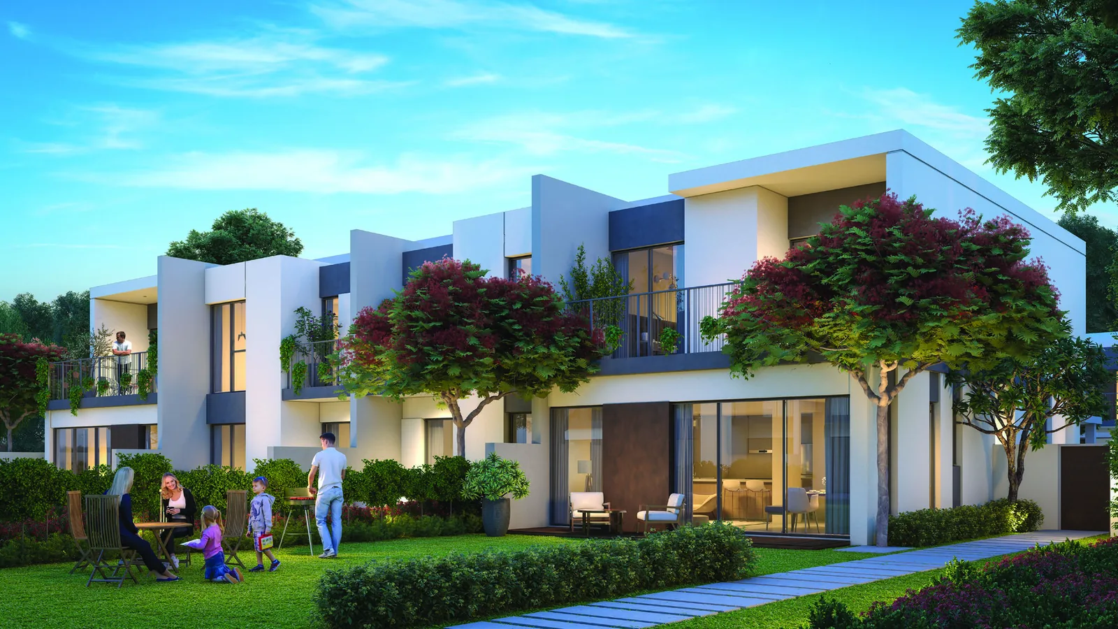 Garden elevation of an Elan townhouse opening onto lawn and green open space