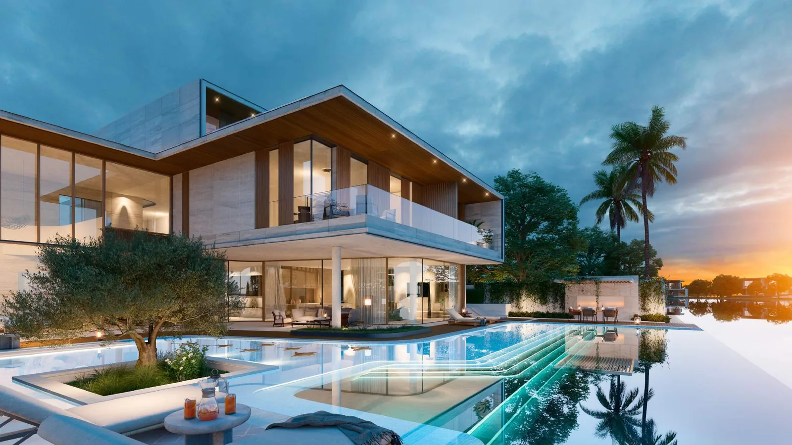Muse mansion and pool deck on the water at Lagoonside, Elysian Mansions, at sunset