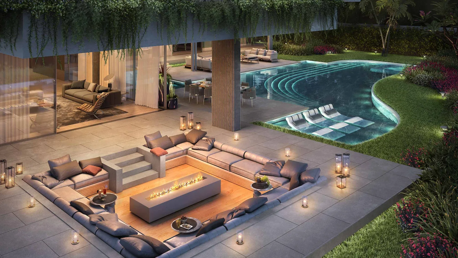 Sunken fire pit lounge and pool terrace at a Lanai Islands estate at night